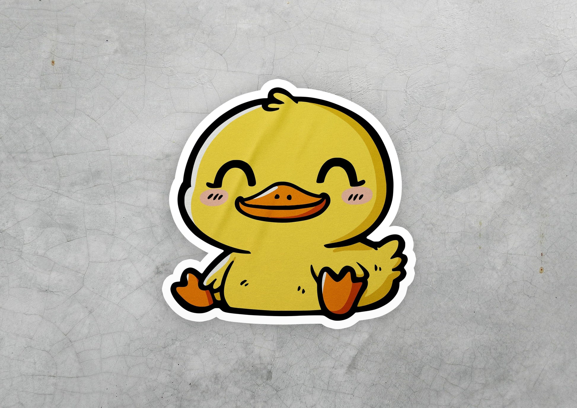 a sticker of a yellow rubber duck