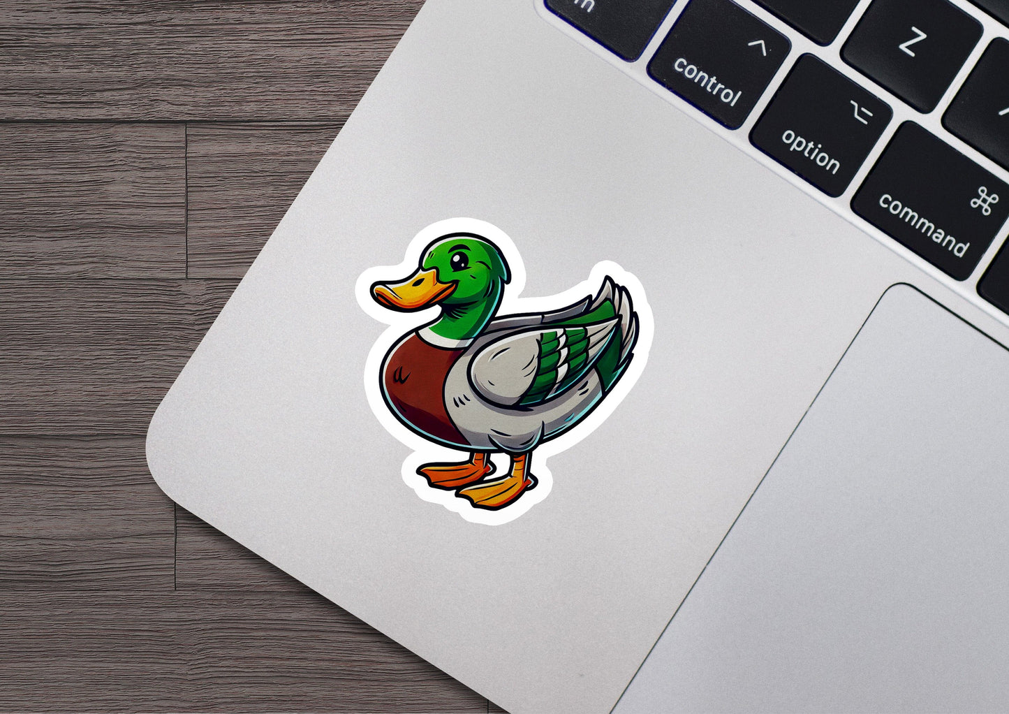 a sticker of a duck sitting on top of a laptop