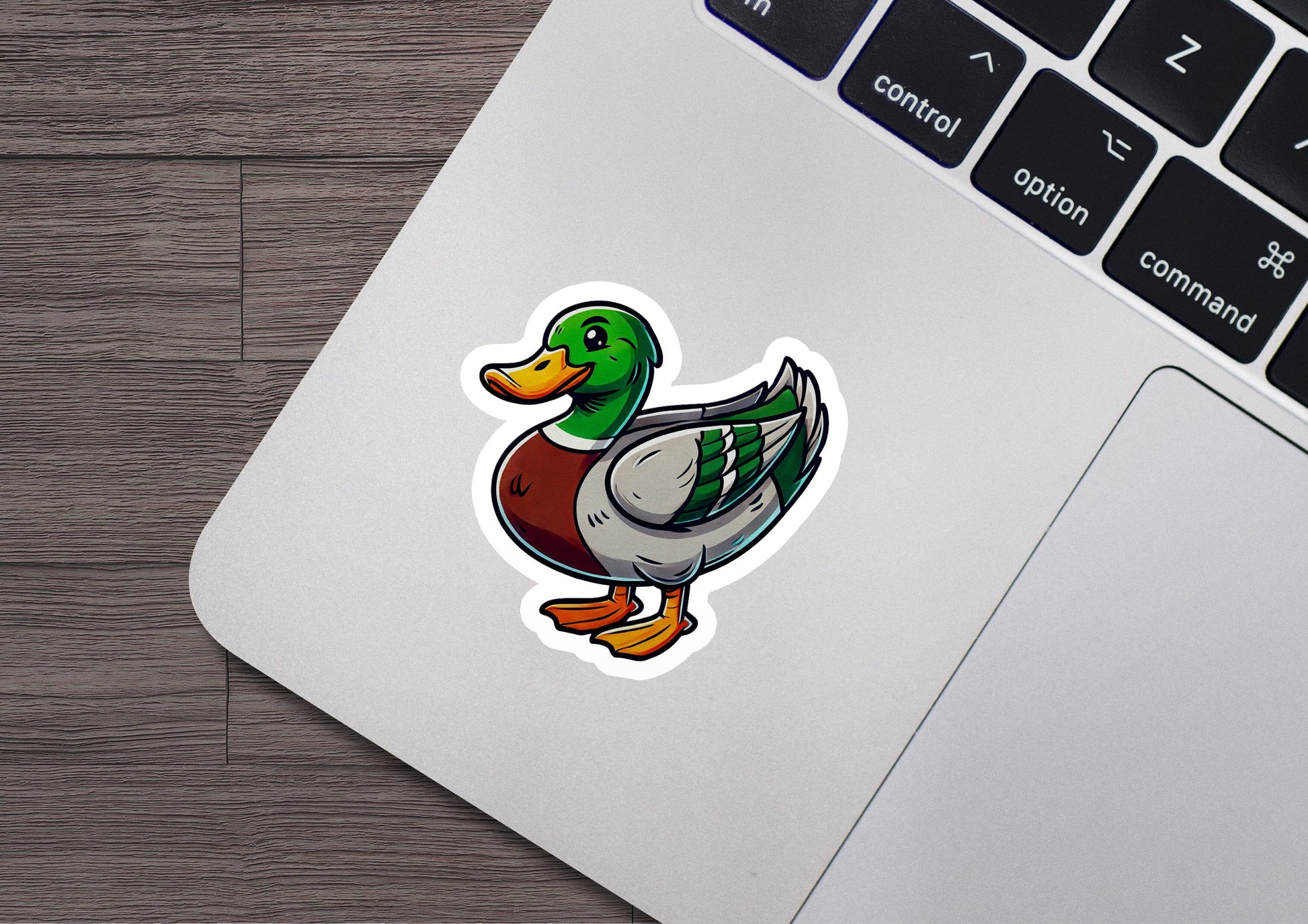 a sticker of a duck sitting on top of a laptop