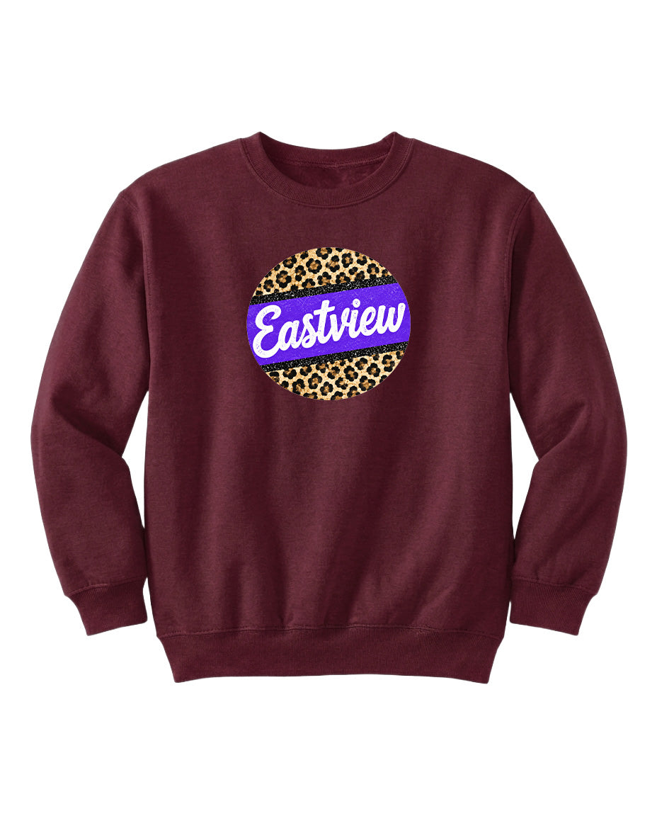 A burgundy sweatshirt with a leopard print design and the word "Eastview" printed on it.