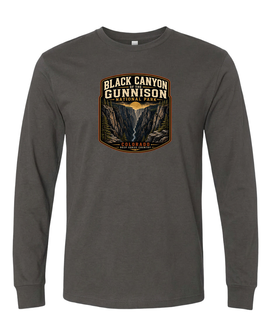 A gray long-sleeved t-shirt with a graphic design depicting the Black Canyon of the Gunnison National Park in Colorado.
