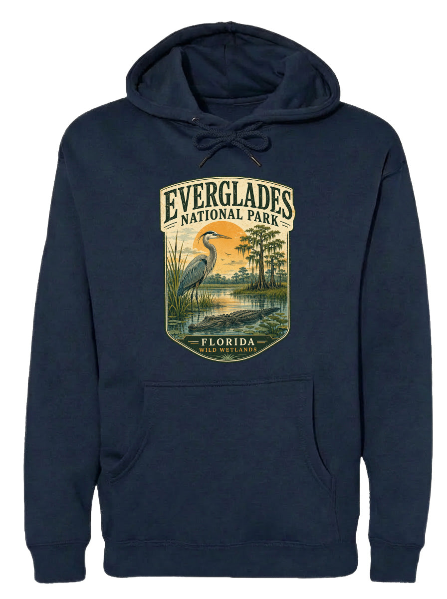 A navy blue hoodie with a graphic design depicting a heron and a sunset over Everglades National Park, Florida.