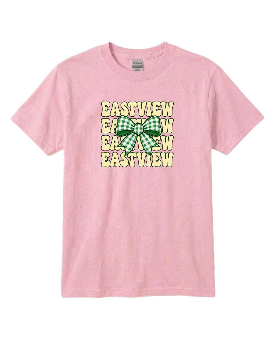 A pink t-shirt with a graphic design featuring a green and white bow and the text "EASTVIEW" repeated multiple times in a vertical pattern.