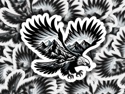 a black and white picture of an eagle with mountains in the background