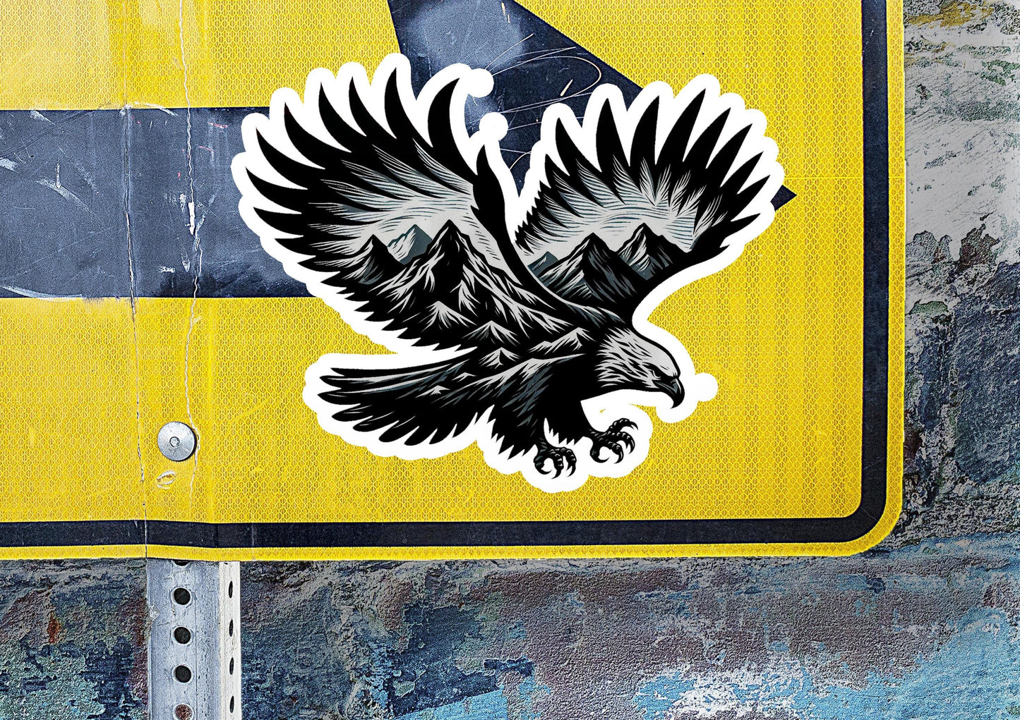 a sticker of an eagle on a yellow and black street sign