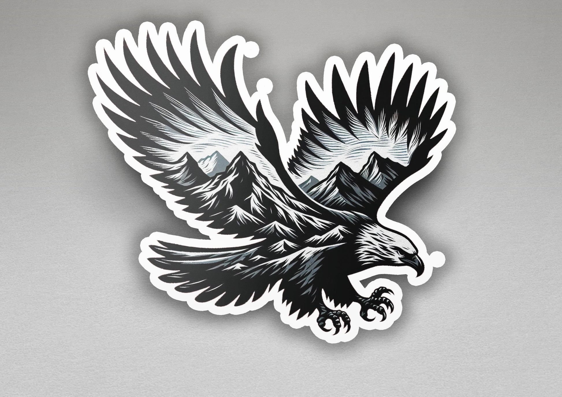 a sticker of an eagle with mountains in the background