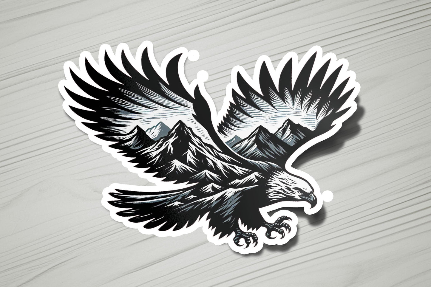 a sticker of an eagle with mountains in the background