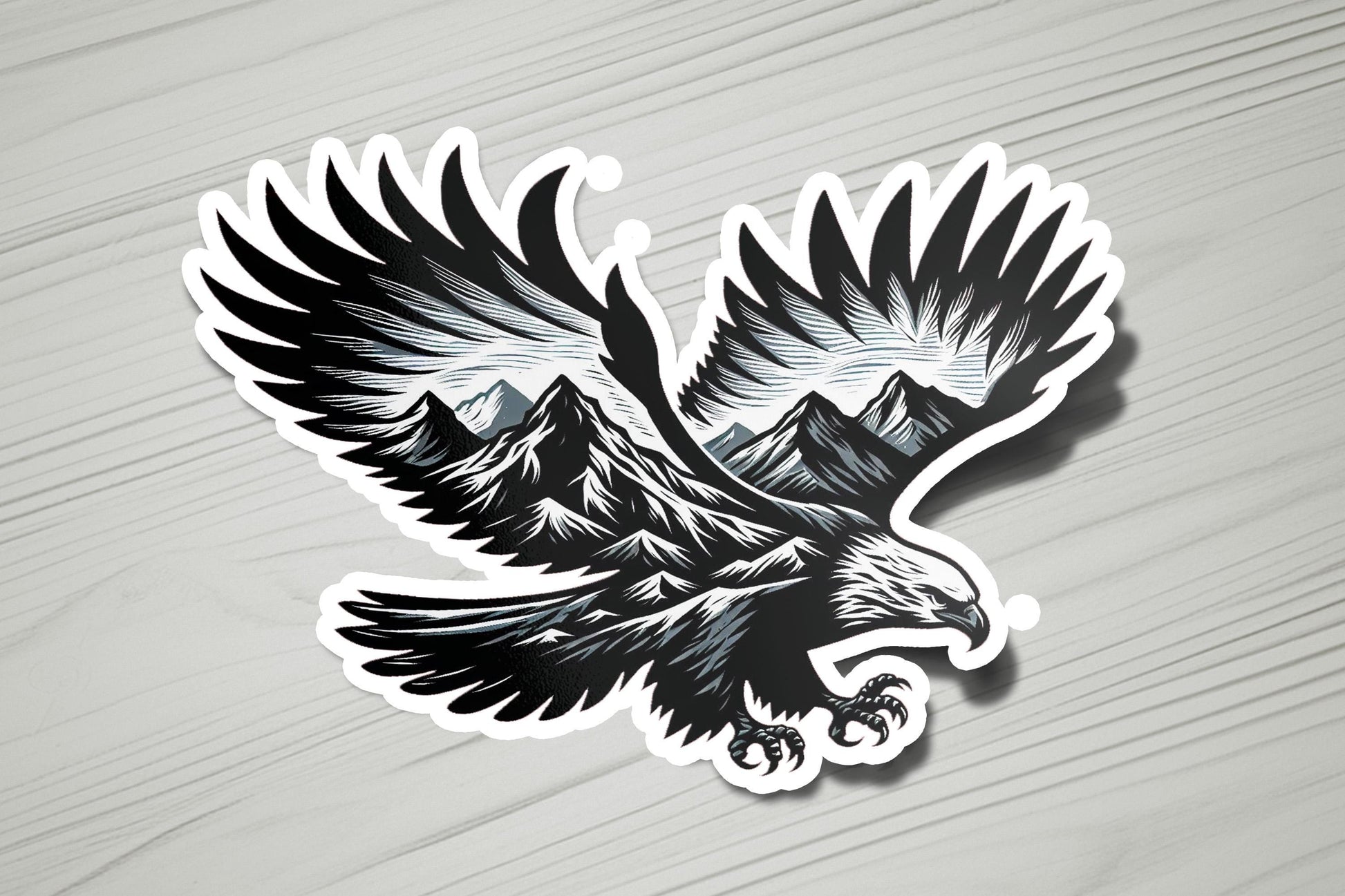 a sticker of an eagle with mountains in the background
