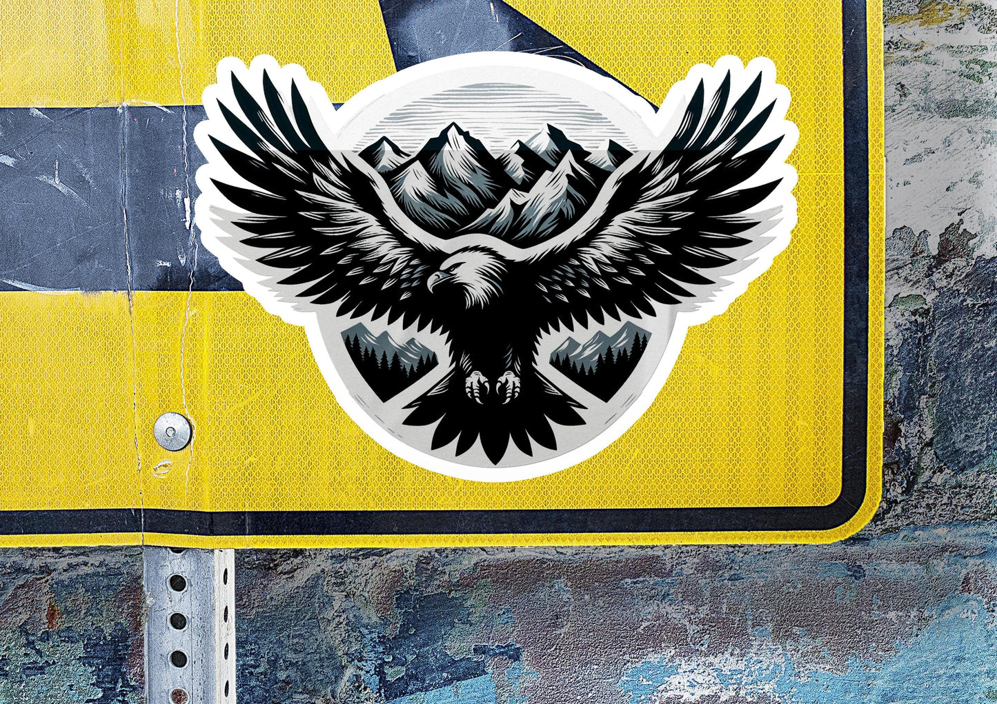 a sticker of an eagle with mountains in the background