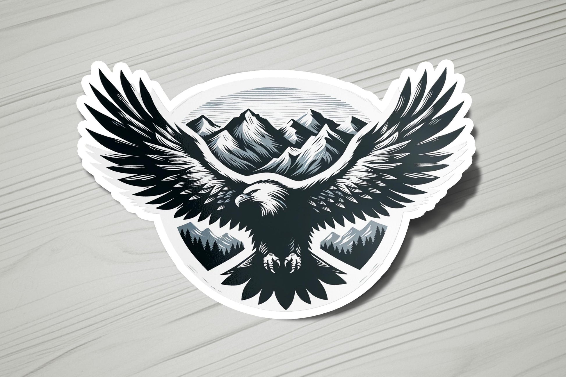 a sticker of an eagle with mountains in the background