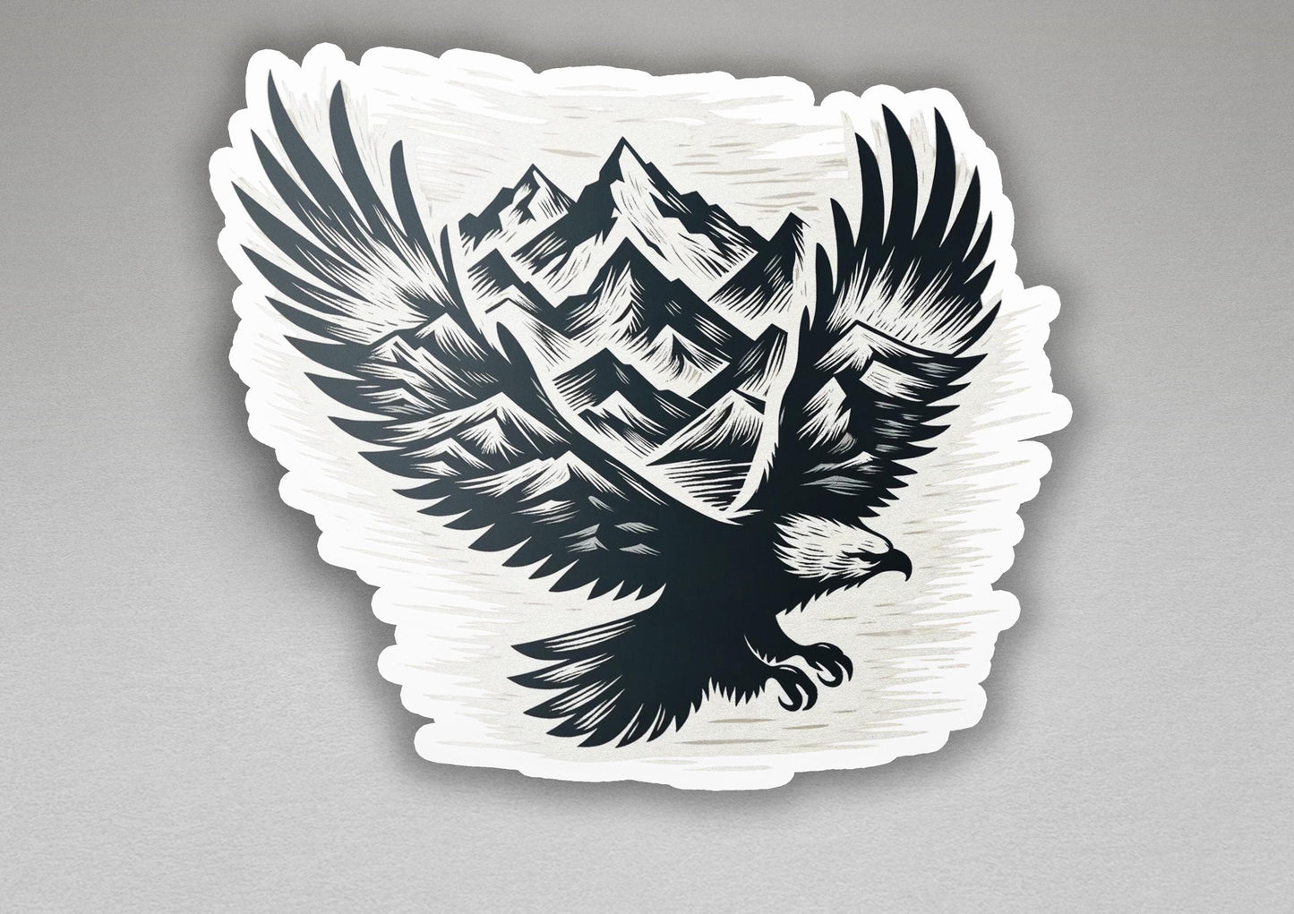 a sticker of an eagle with mountains in the background