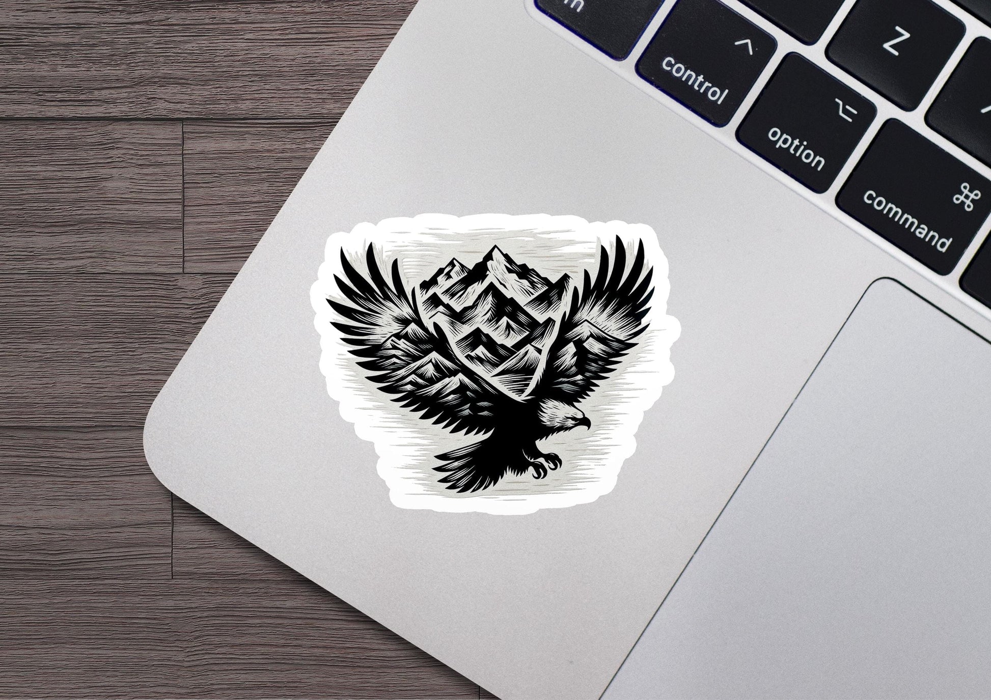 a laptop with a sticker of a bird on it