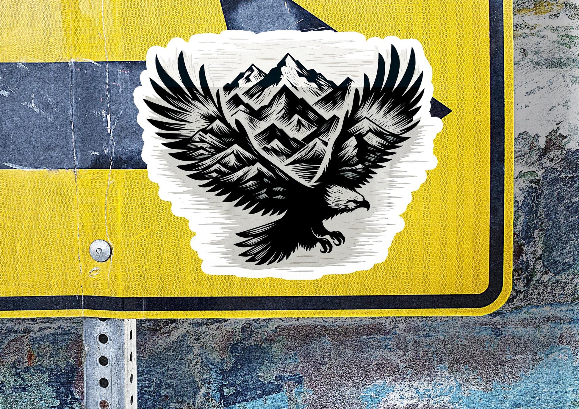 a sticker of an eagle with mountains in the background