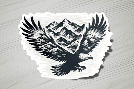 a sticker of an eagle with mountains in the background