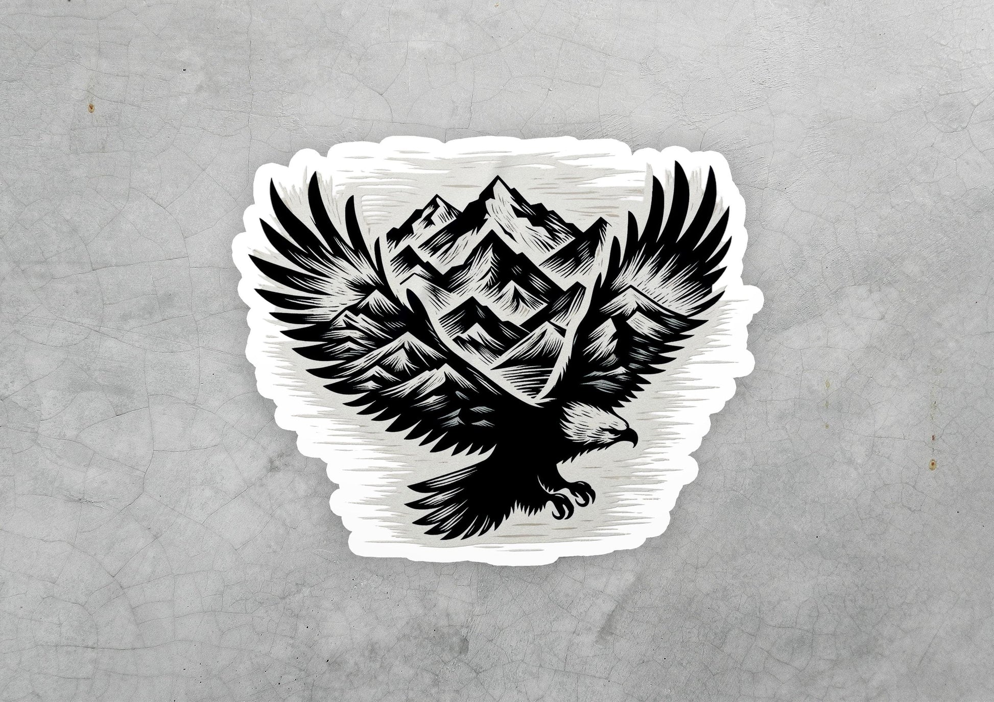 a sticker of an eagle with mountains in the background