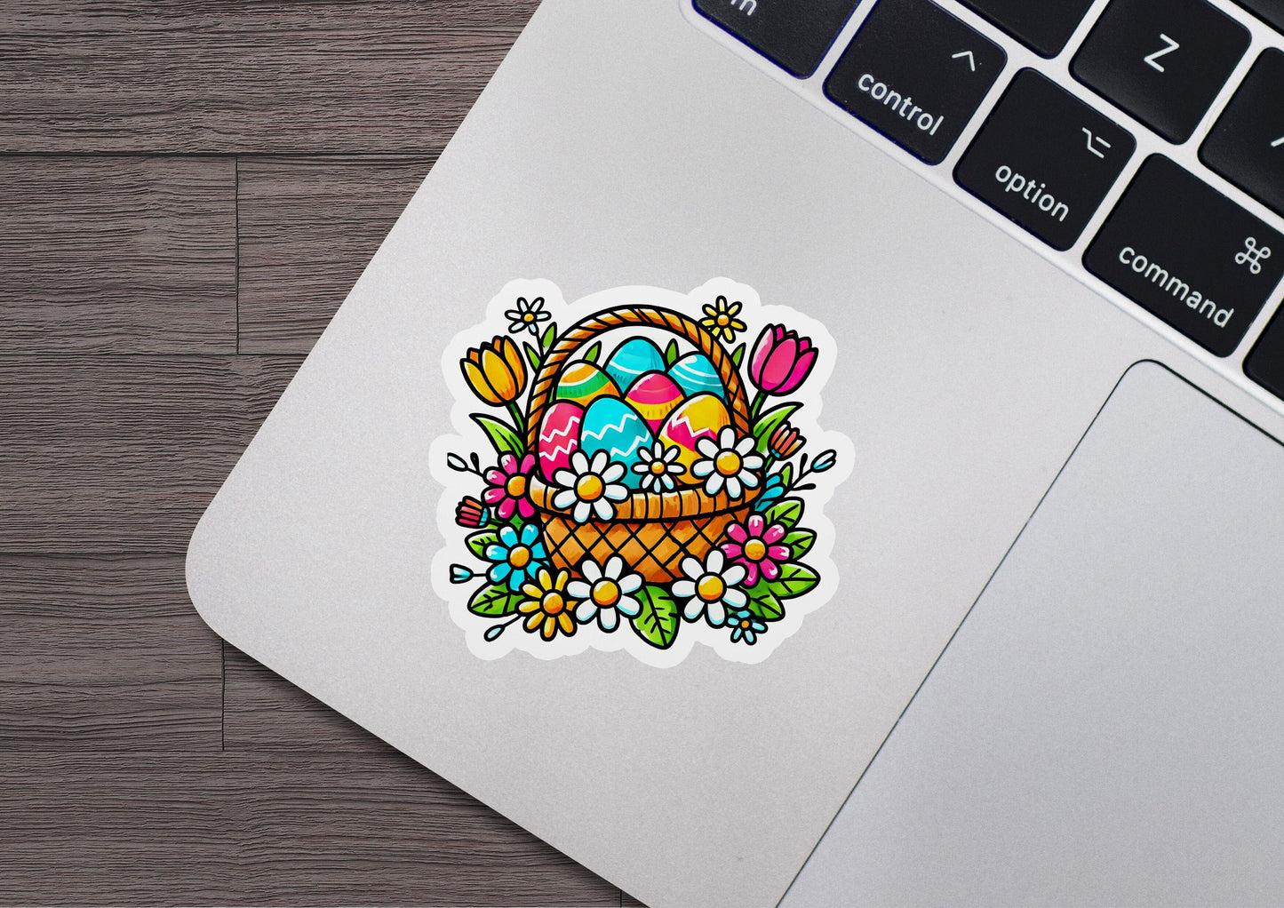 a laptop with a sticker of a basket of eggs
