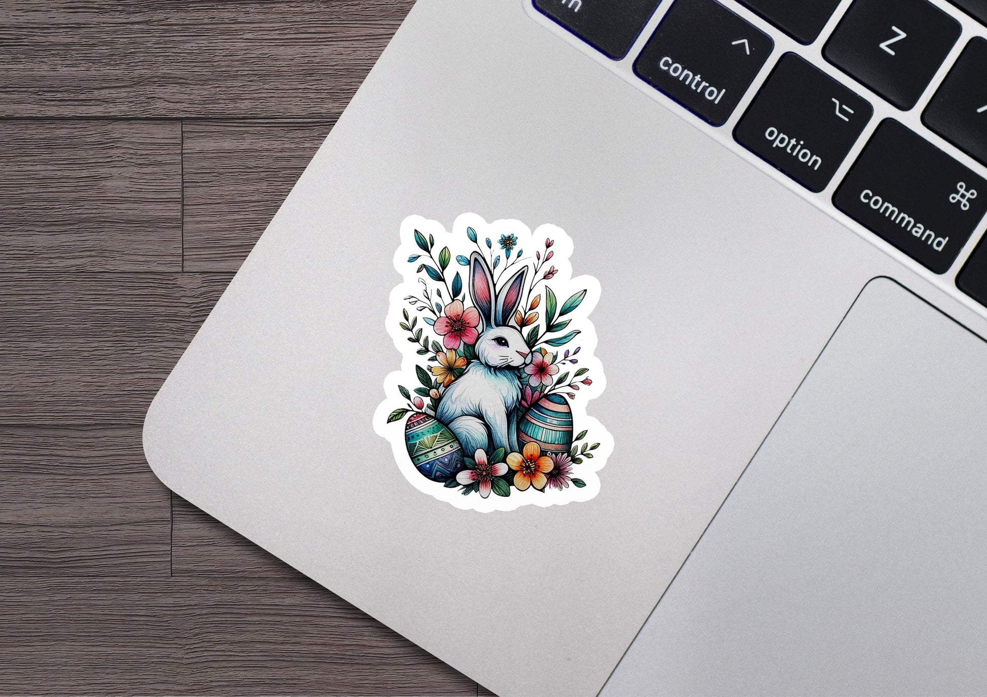 a laptop computer with a sticker of a rabbit on it