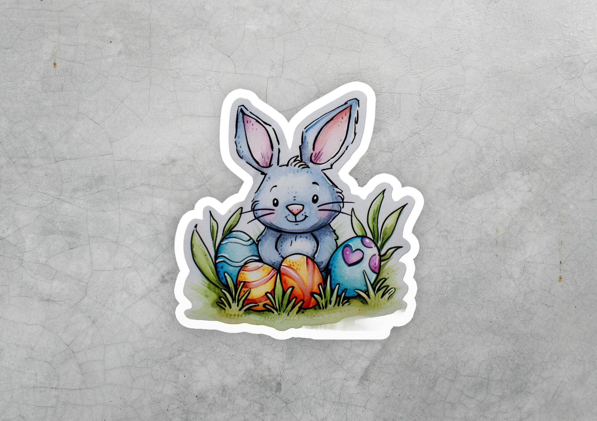 a sticker of a rabbit sitting in the grass