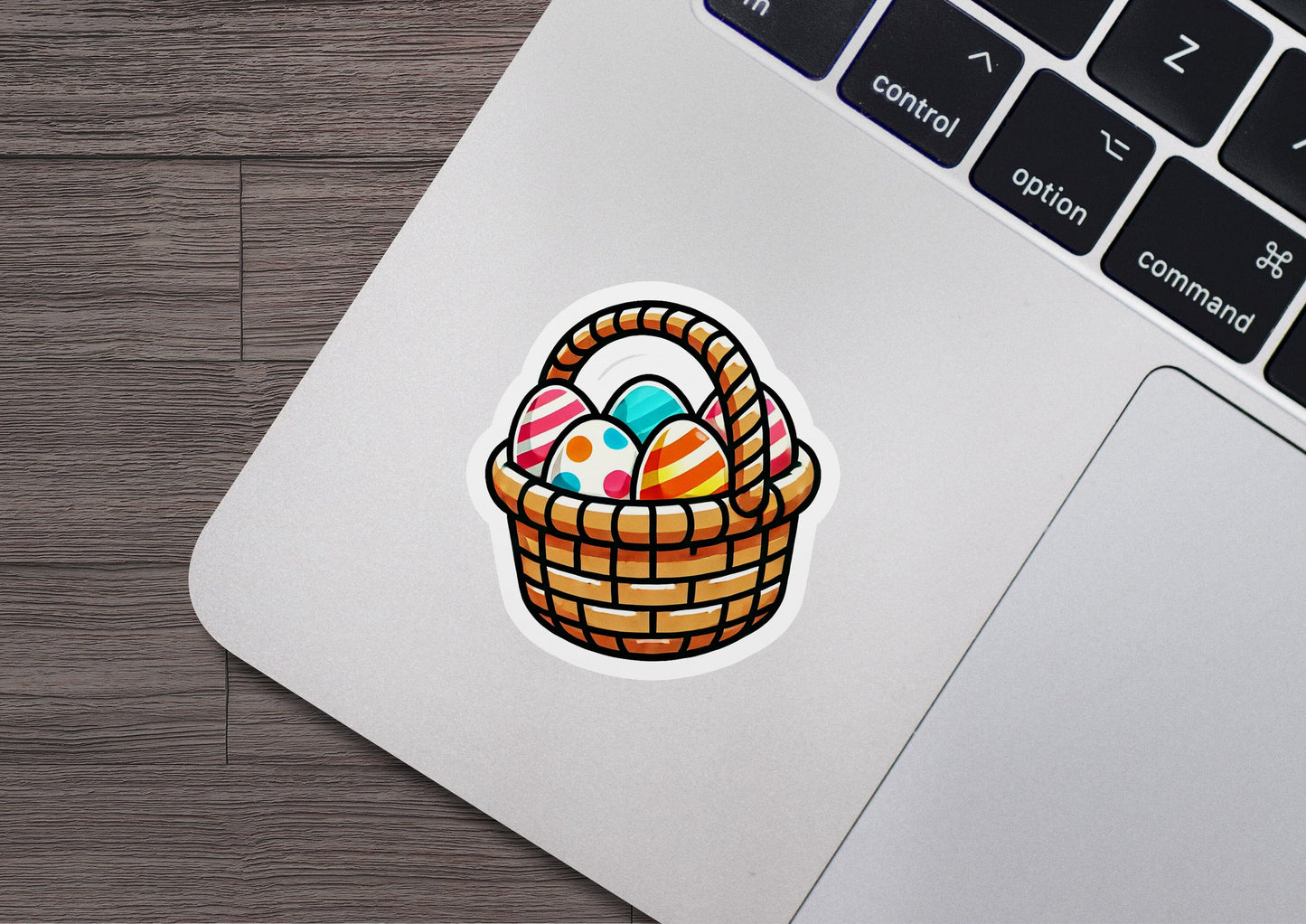 a laptop with a sticker of an easter basket
