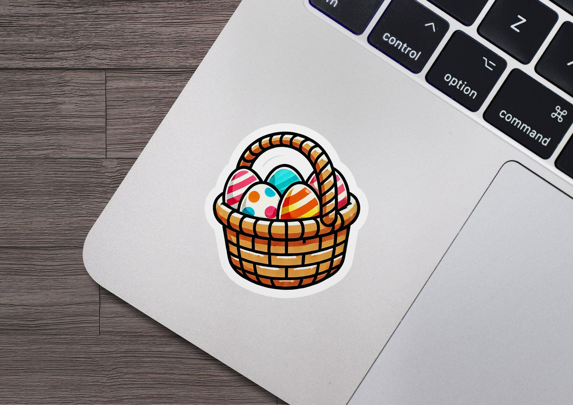 a laptop with a sticker of an easter basket