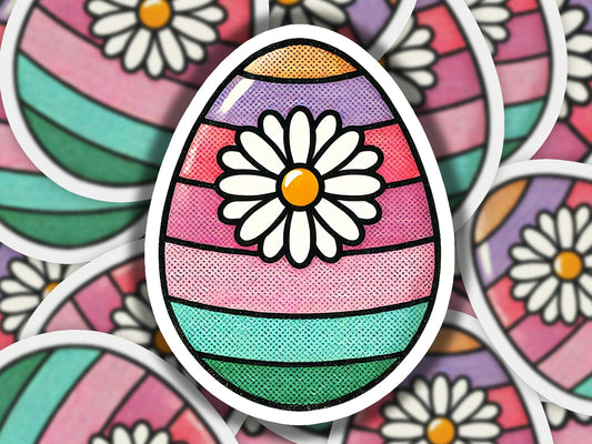 a close up of an easter egg with flowers on it