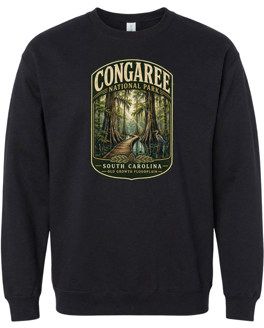 A black sweatshirt with a graphic design depicting a forest scene with a path leading through it.