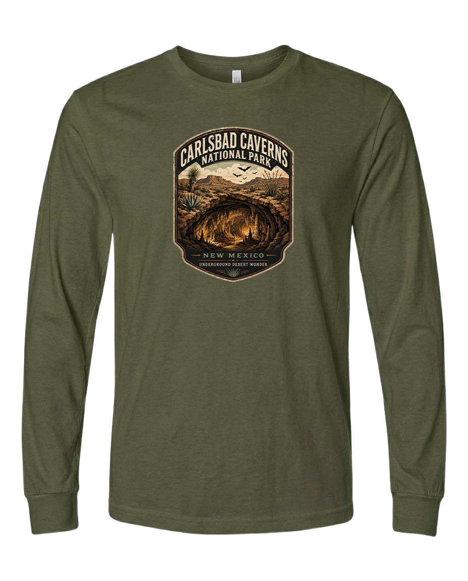 A long-sleeved olive green t-shirt with a graphic design featuring the Carlsbad Caverns National Park in New Mexico.