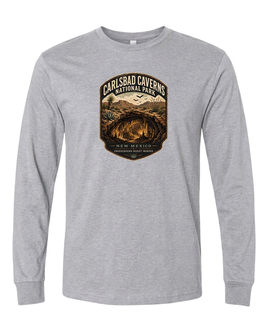 A gray long-sleeved t-shirt with a graphic design featuring the Carlsbad Caves National Park in New Mexico.