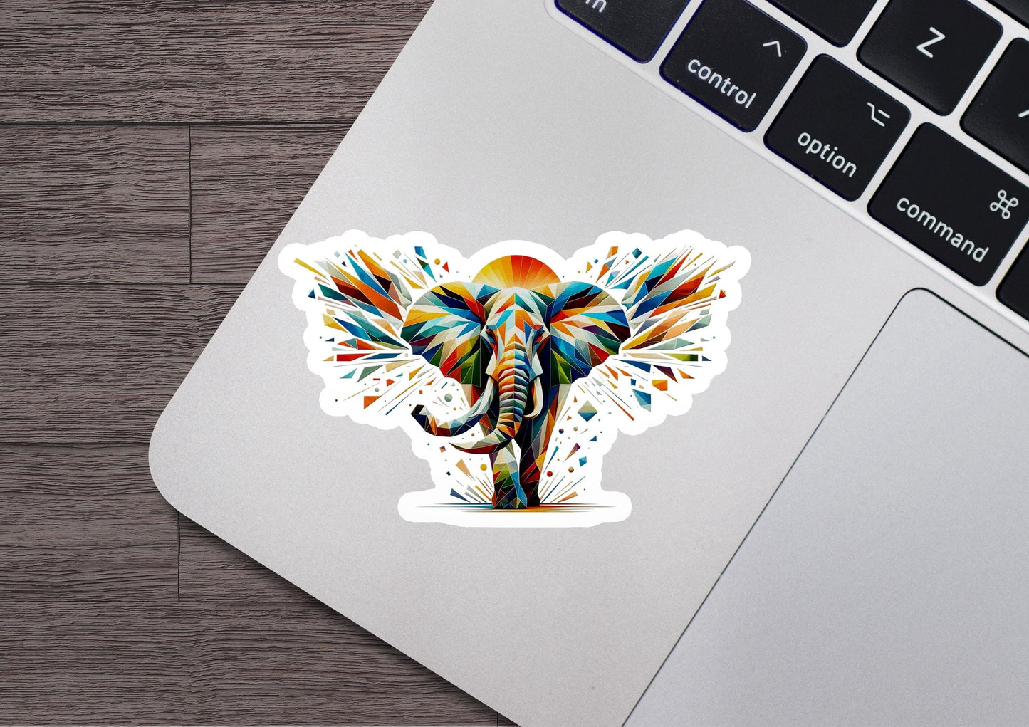 an elephant sticker on a laptop keyboard