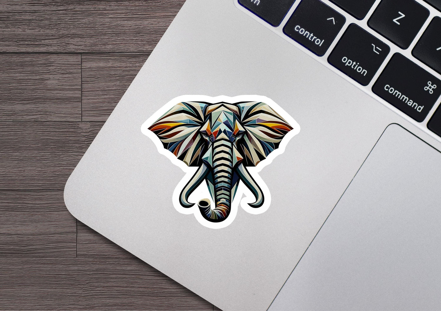 an elephant sticker on a laptop keyboard