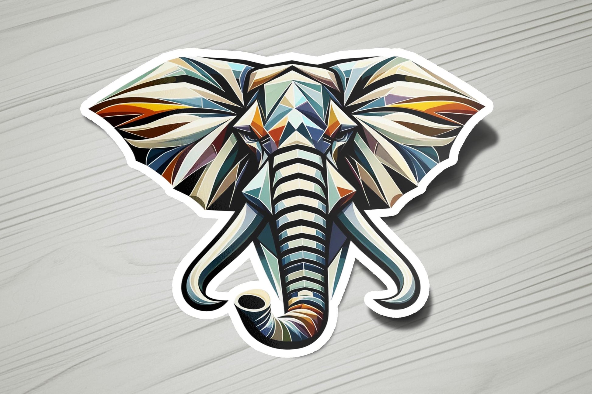 a sticker of an elephant's head on a wooden surface