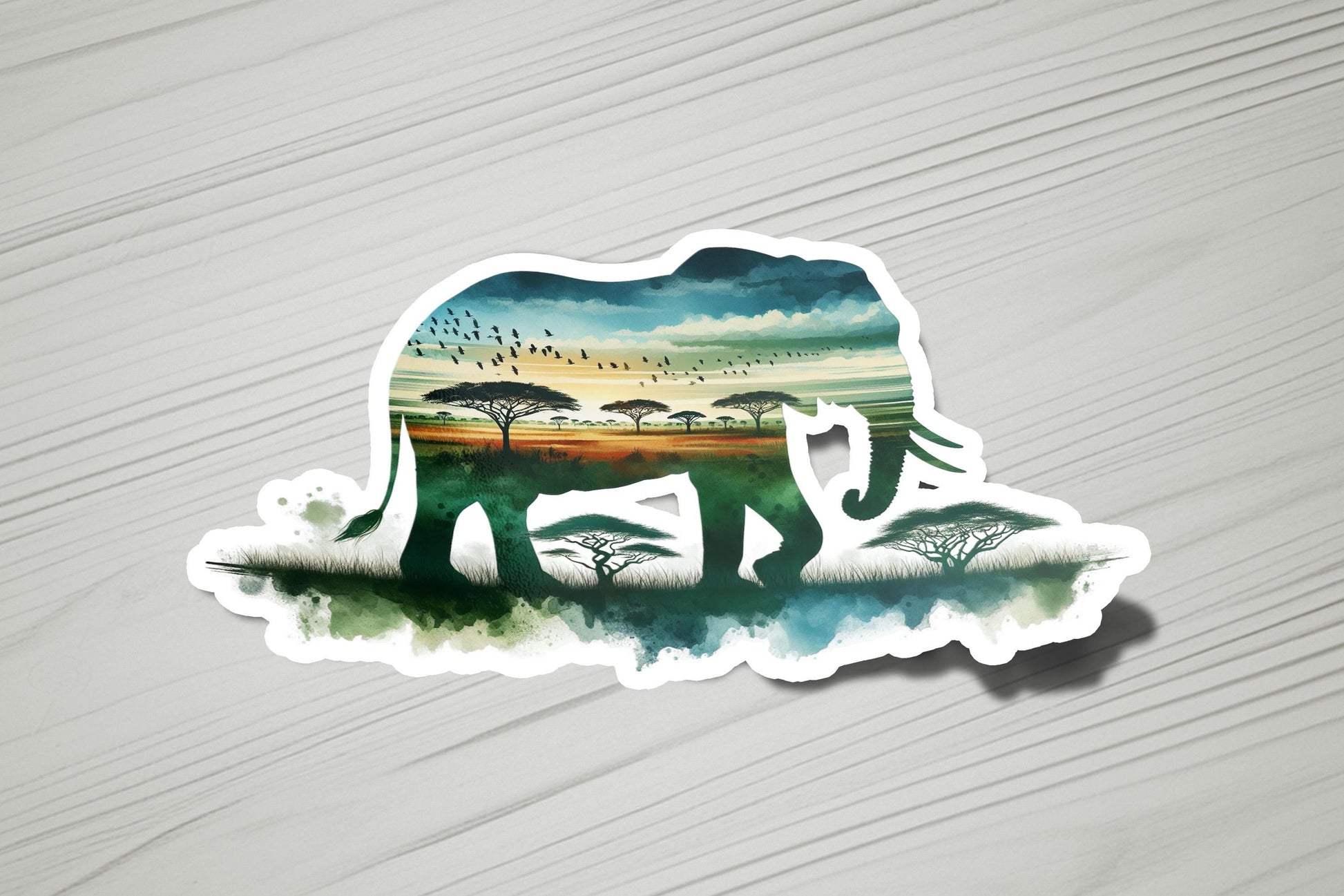 a sticker of an elephant with trees in the background