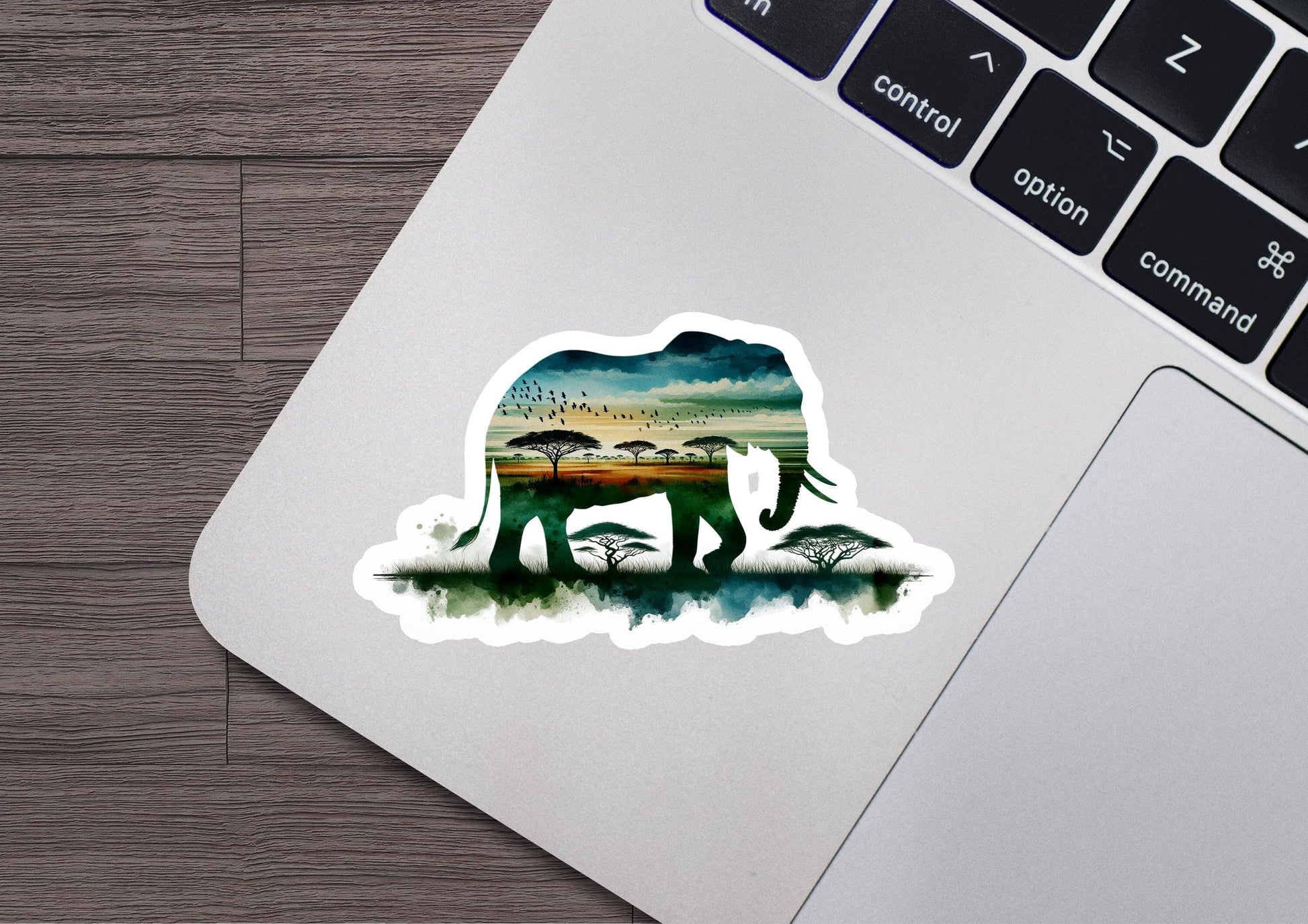 an elephant sticker on a laptop computer