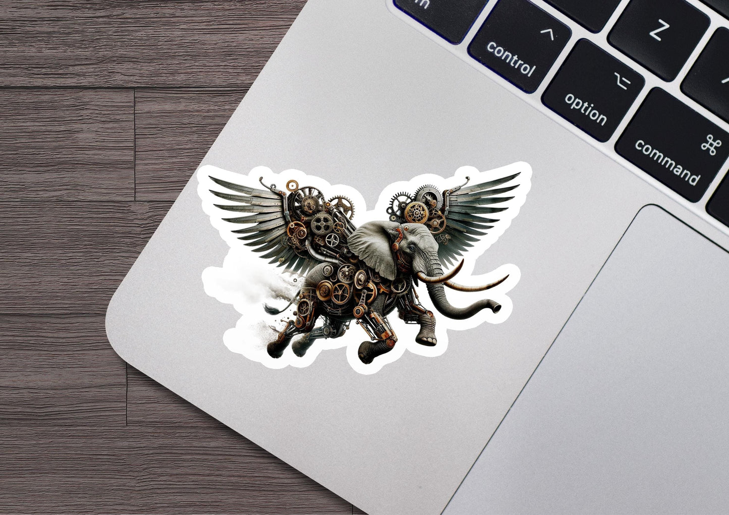 a sticker of an elephant with wings on a laptop