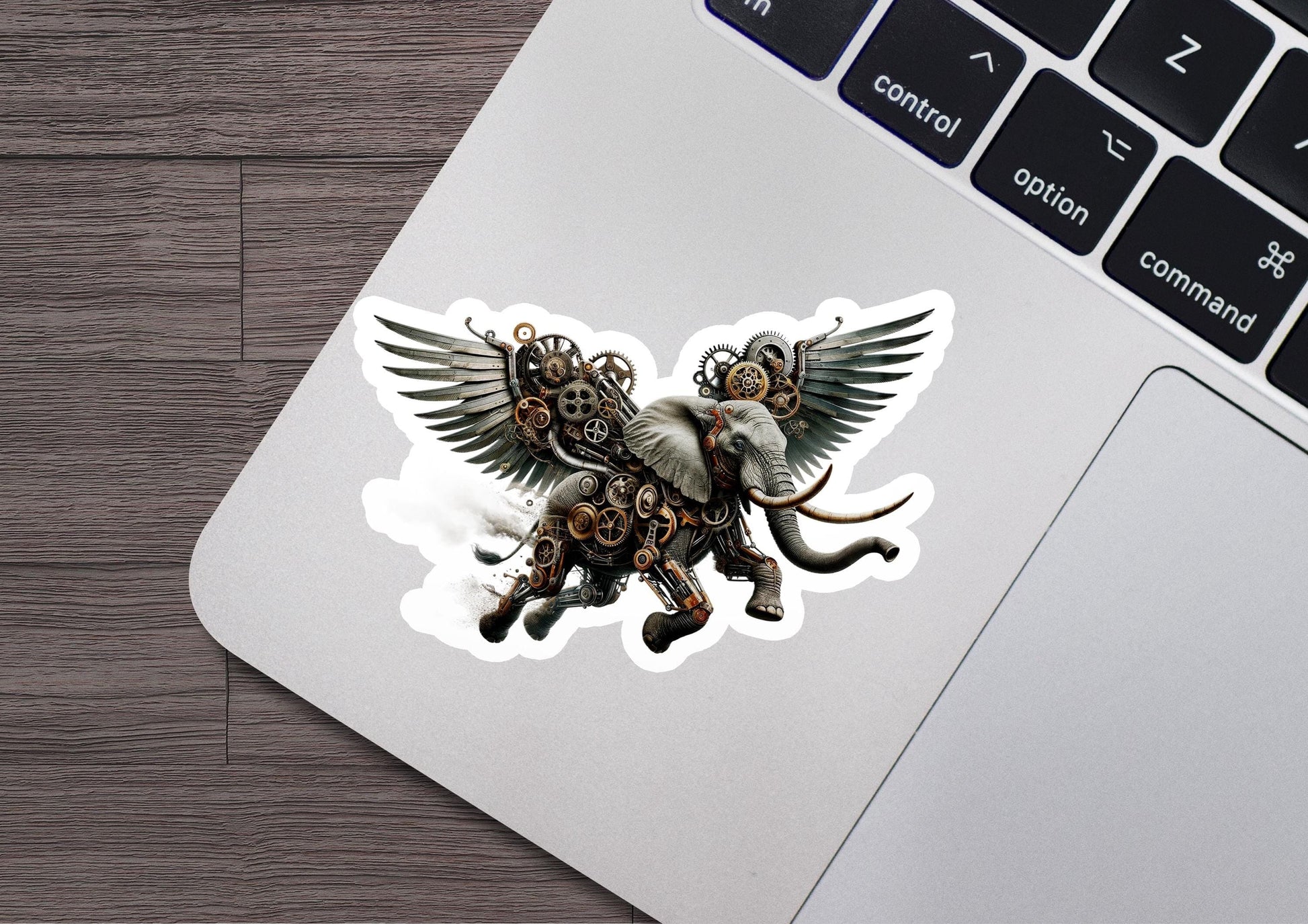 a sticker of an elephant with wings on a laptop