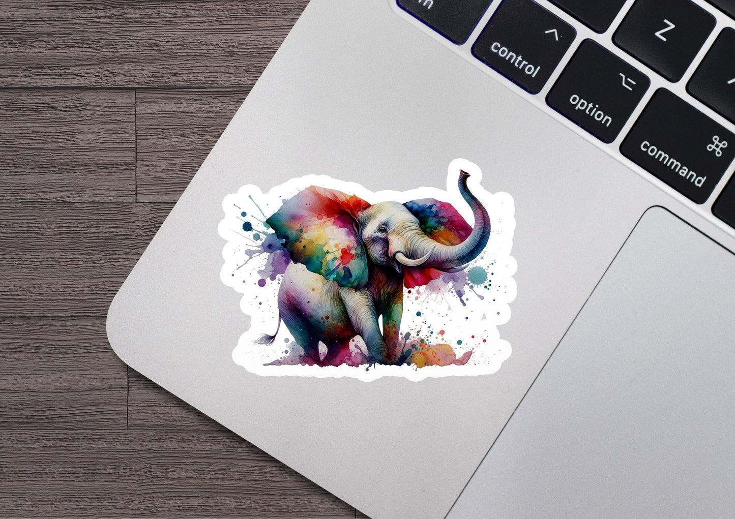 an elephant sticker on a laptop keyboard