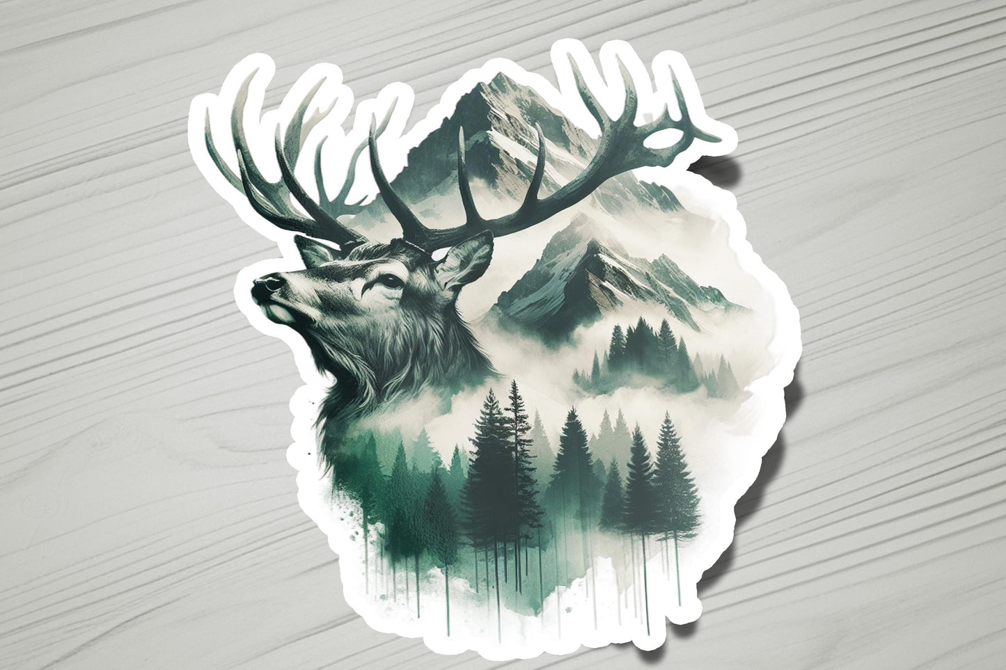a sticker of a deer&#39;s head with trees and mountains in the background