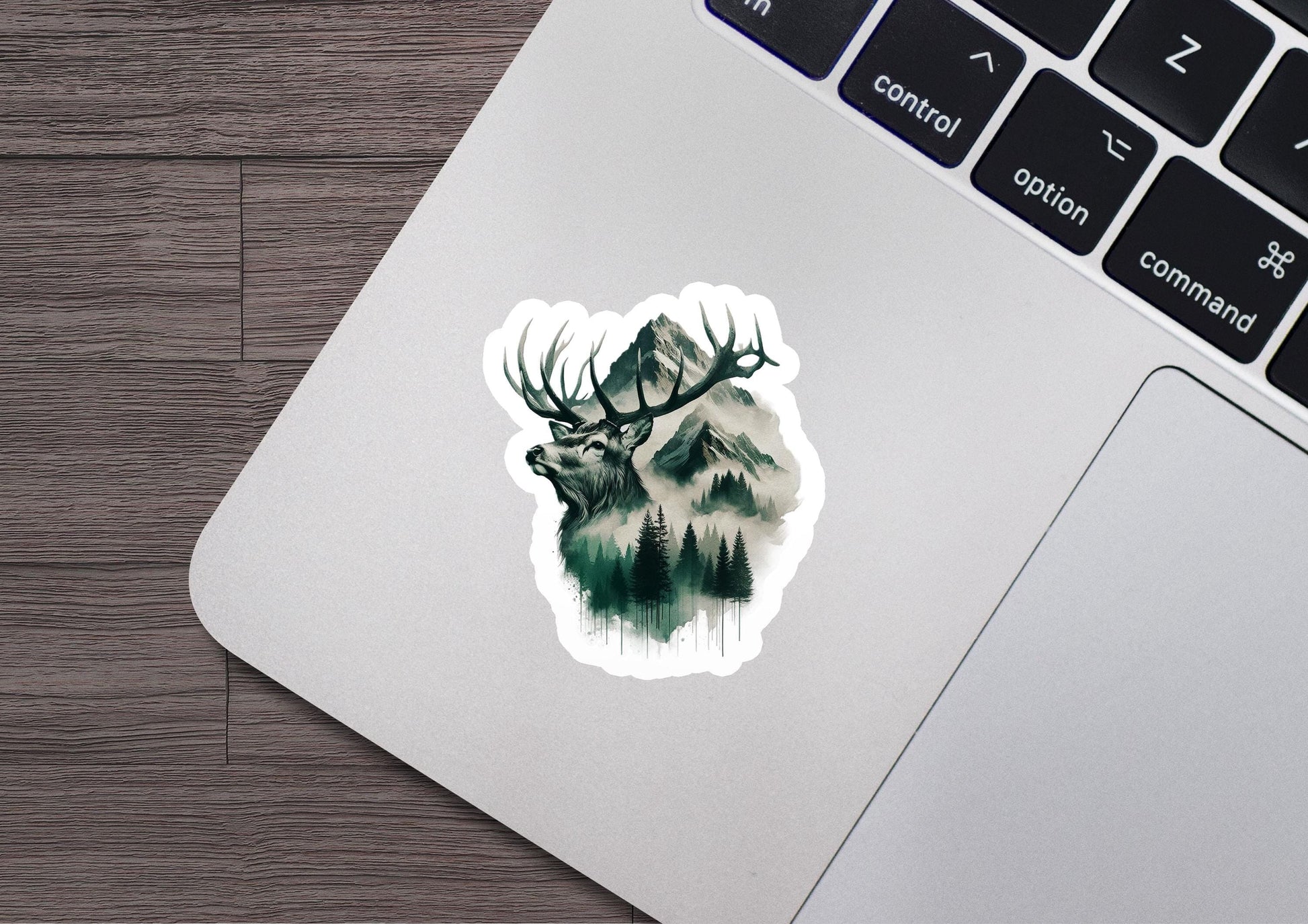 a laptop with a sticker of a deer on it