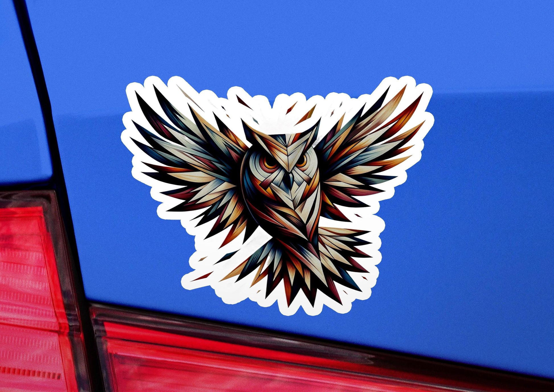 an owl sticker on the back of a car
