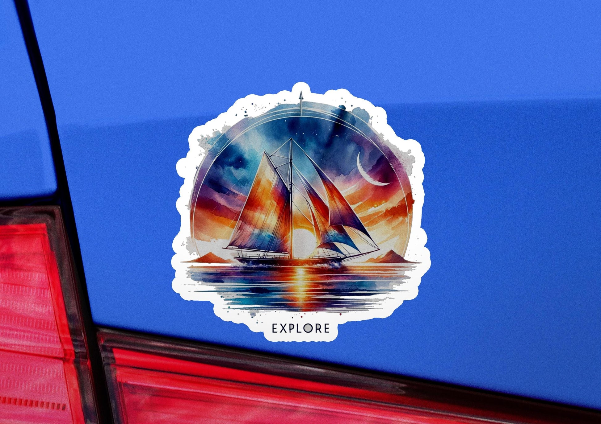 a sticker of a sailboat on the back of a car