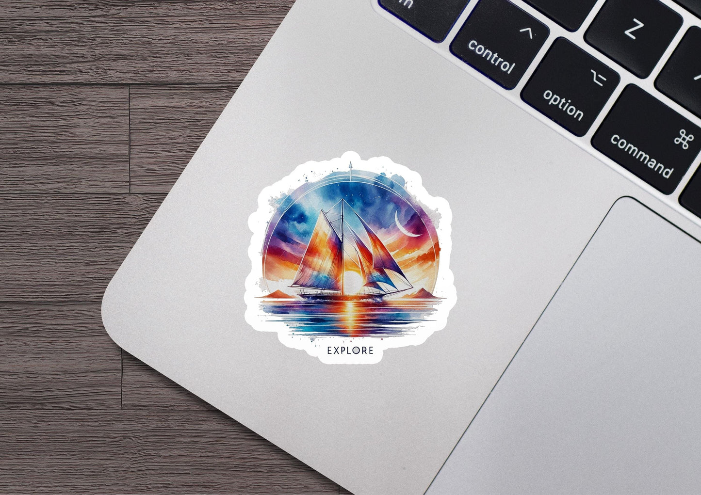 a laptop with a sticker of a sailboat on it