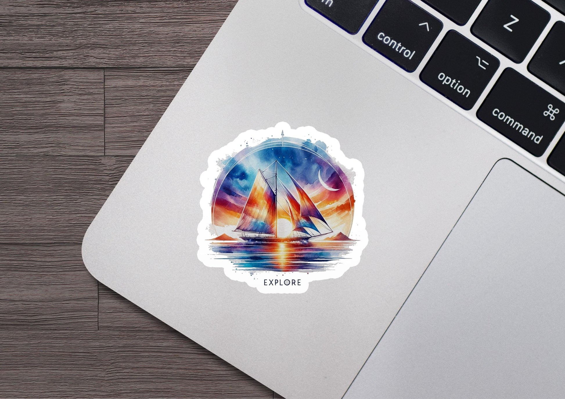 a laptop with a sticker of a sailboat on it