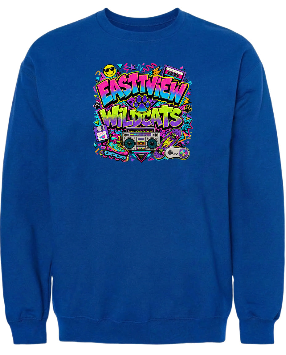 A blue sweatshirt with a colorful graphic design featuring the text "EASTVIEW WILDCATS" surrounded by various icons and elements, such as a boombox, a video game controller, and a retro-style camera.