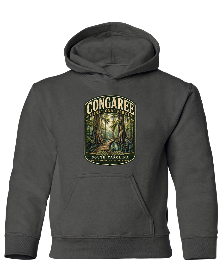 A gray hooded sweatshirt with a graphic design depicting a forest scene and the text "CONGAREE NATIONAL PARK SOUTH CAROLINA" printed on it.