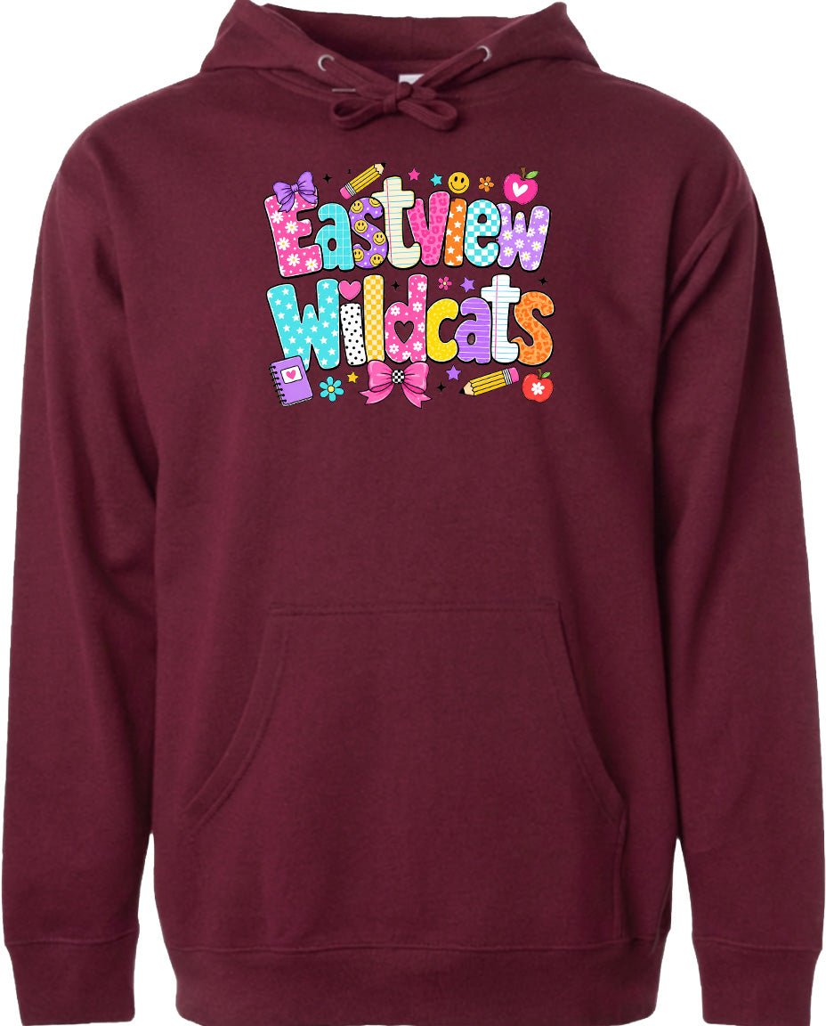 A burgundy hoodie with a colorful graphic design featuring the text "Eastview Wildcats" and various school-related icons such as pencils, apples, and a backpack.