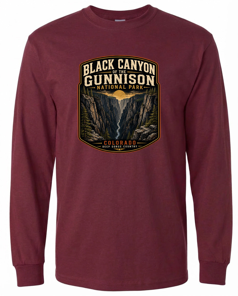 A long-sleeved burgundy t-shirt with a graphic design depicting the Black Canyon of the Gunnison National Park in Colorado.