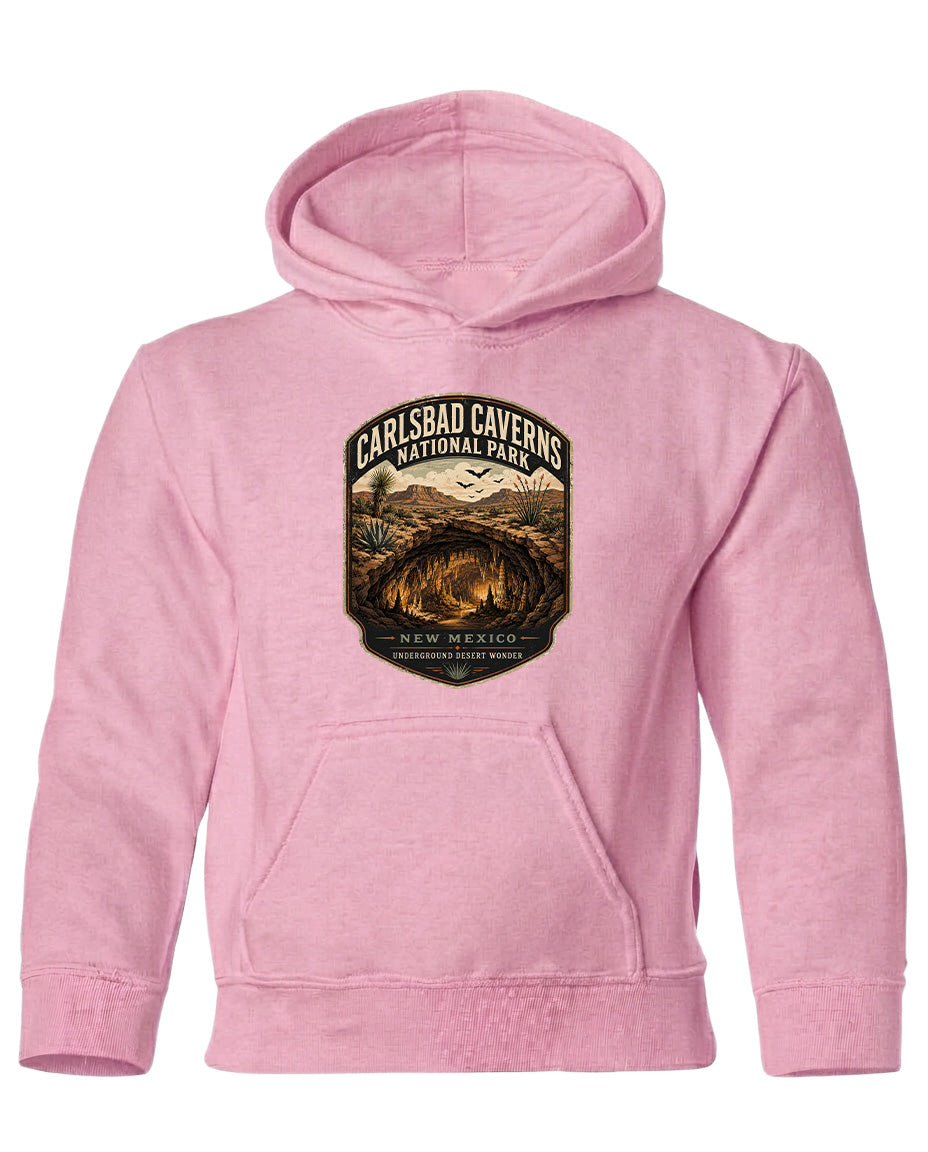 A pink hoodie with a graphic design depicting a cave or natural landscape.