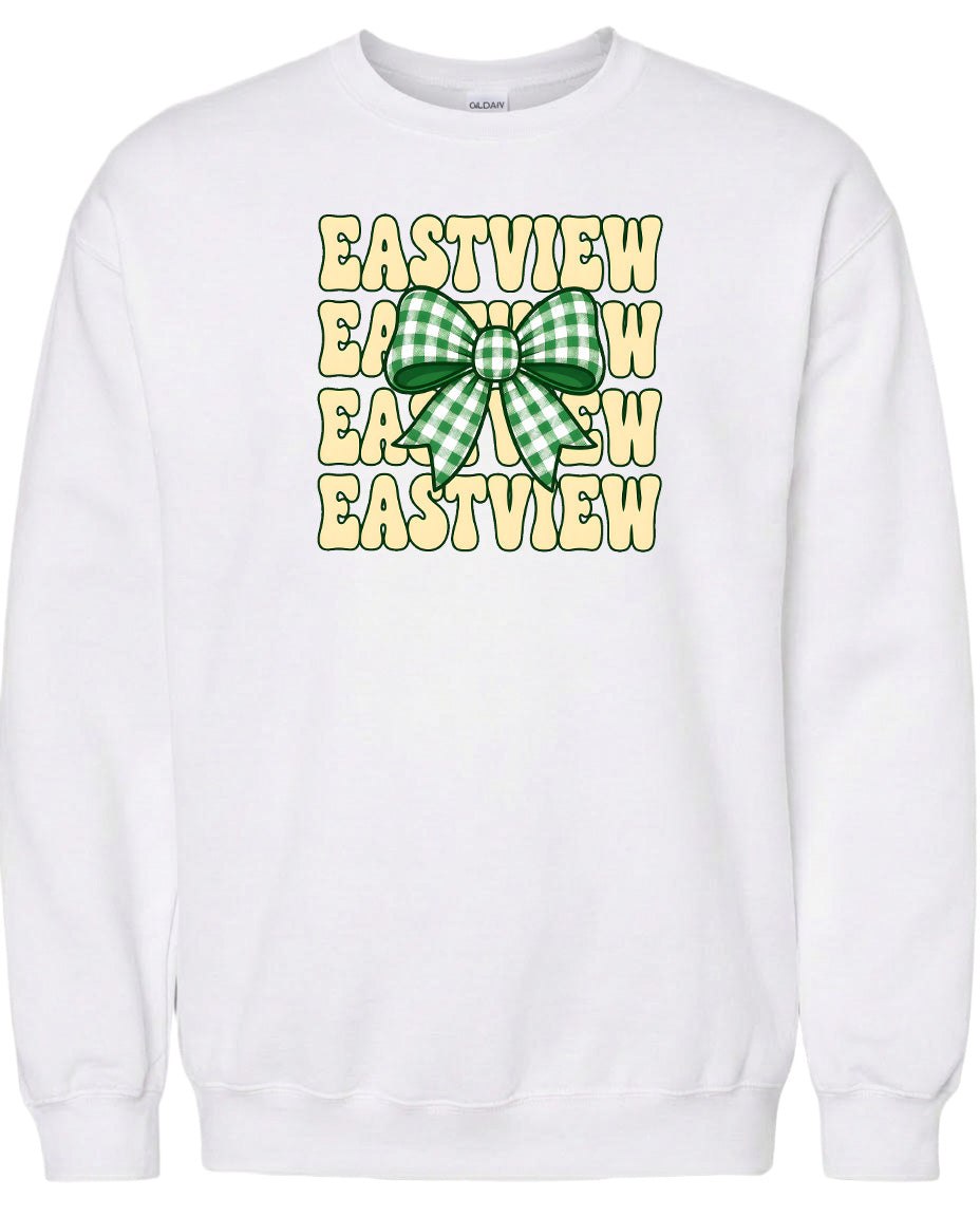 A white sweatshirt with a graphic design featuring a green and white checkered bow on the front.