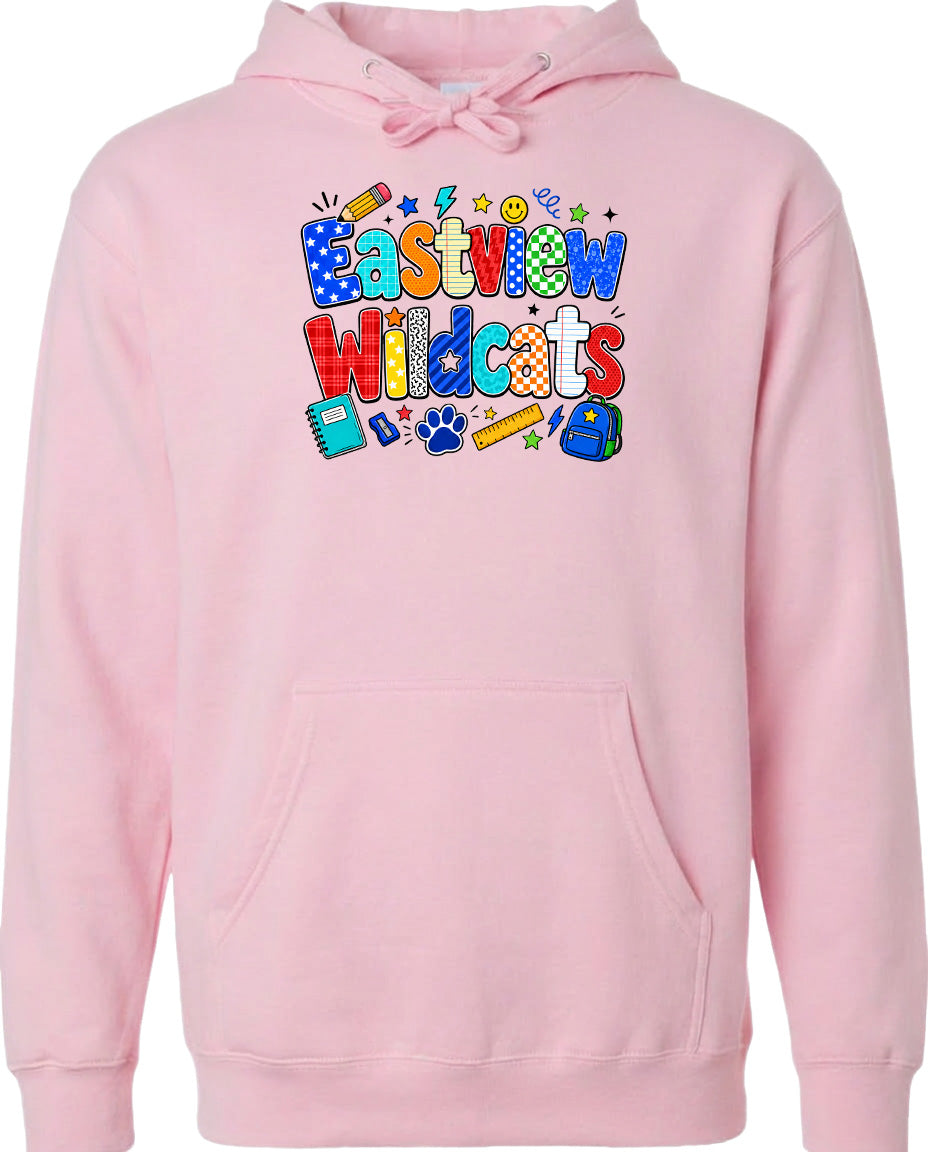 A pink hoodie with a colorful graphic design featuring the text "Eastview Wildcats" and various school-related icons such as a backpack, pencil, and book.