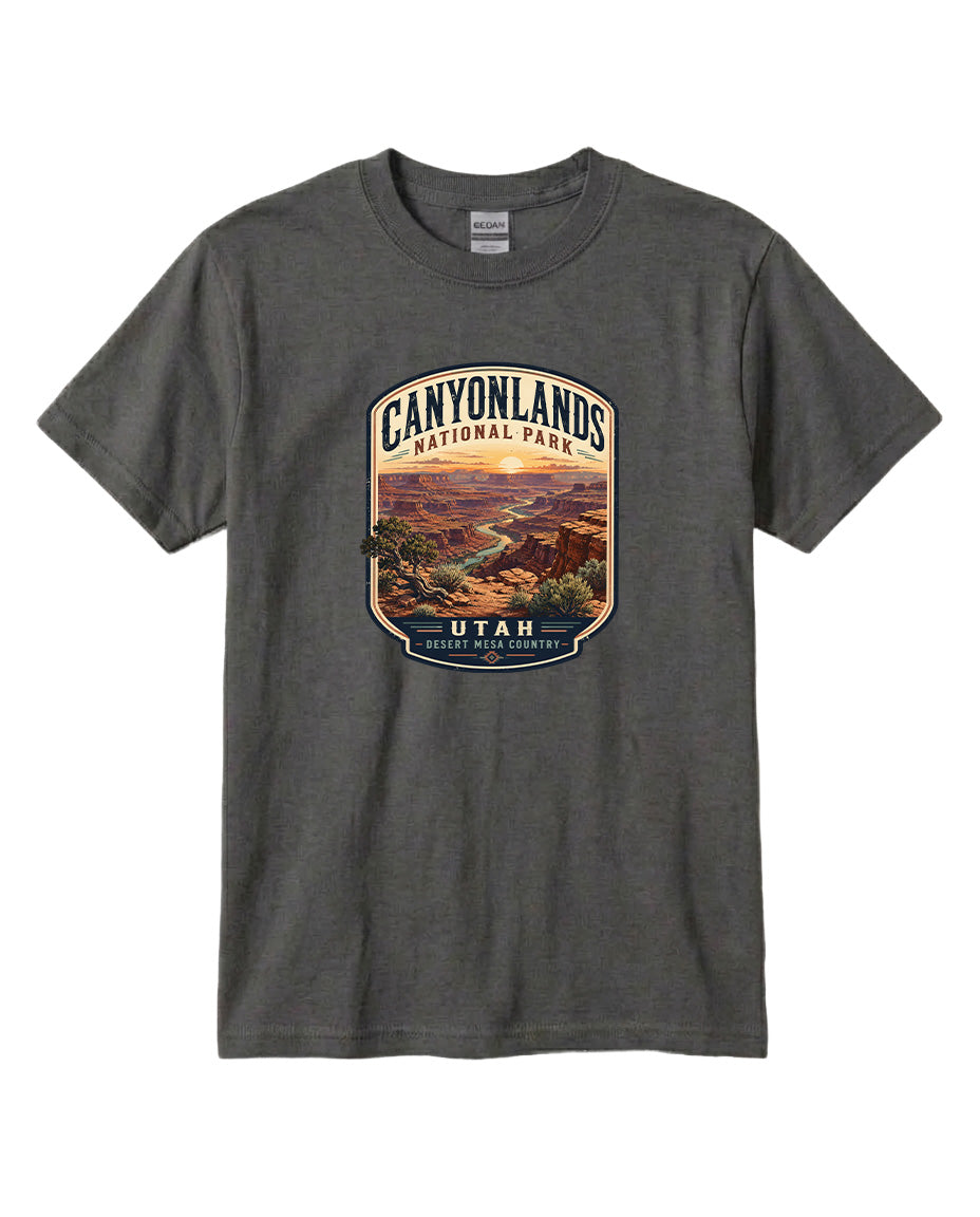 A gray t-shirt with a graphic design depicting a scenic landscape of the Canyons National Park in Utah.